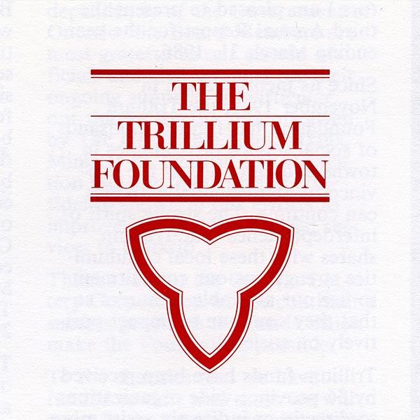 A depiction of the Ontario Trillium Foundation logo used from 1982-1994. It has a white graphic trillium with a red outline and the words The Trillium Foundation above it. 