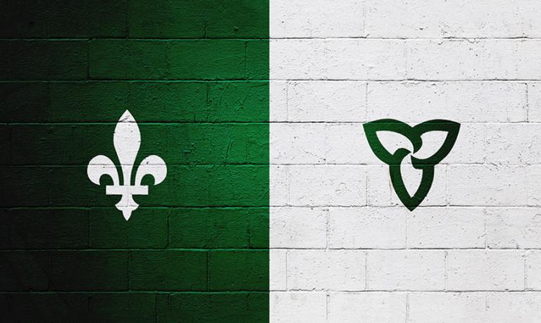 A green square with white fleur-de-lis logo beside an equal-sized white square with a trillium logo representing the Franco-Ontarian flag.